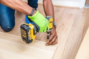pexels-bidvine-517980-1249610 - Burch Brothers Flooring Burch Brothers flooring specialist maintaining hardwood floors